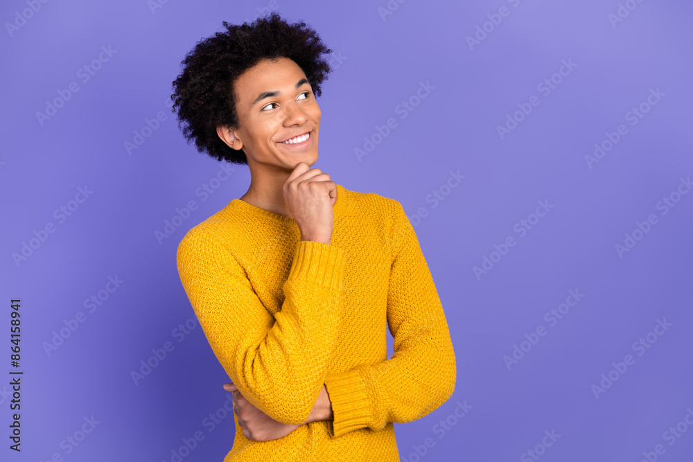 Photo of attractive nice man wear trendy yellow clothes arm chin look empty space isolated on purple color background Photo of attractive nice man wear trendy yellow clothes arm chin look empty space isolated on purple color background