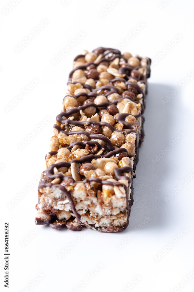 Healthy Muesli bars with nut and black chocolate isolated on white background Healthy Muesli bars with nut and black chocolate isolated on white background