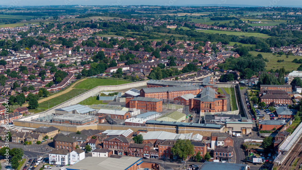 Obraz premium Wakefield Prison in West Yorkshire. Aerial view of the prison buildings and walls, fences and surrounding area. High security prison and correctional facility in Wakefield, united Kingdom 