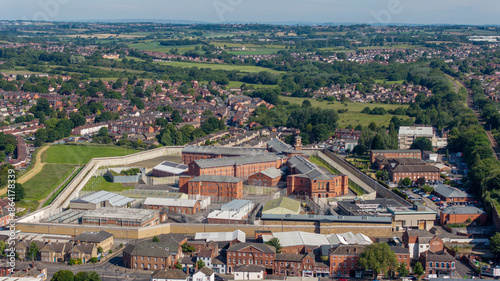 Wakefield Prison in West Yorkshire. Aerial view of the prison buildings and walls, fences and surrounding area. High security prison and correctional facility in Wakefield, united Kingdom  photo