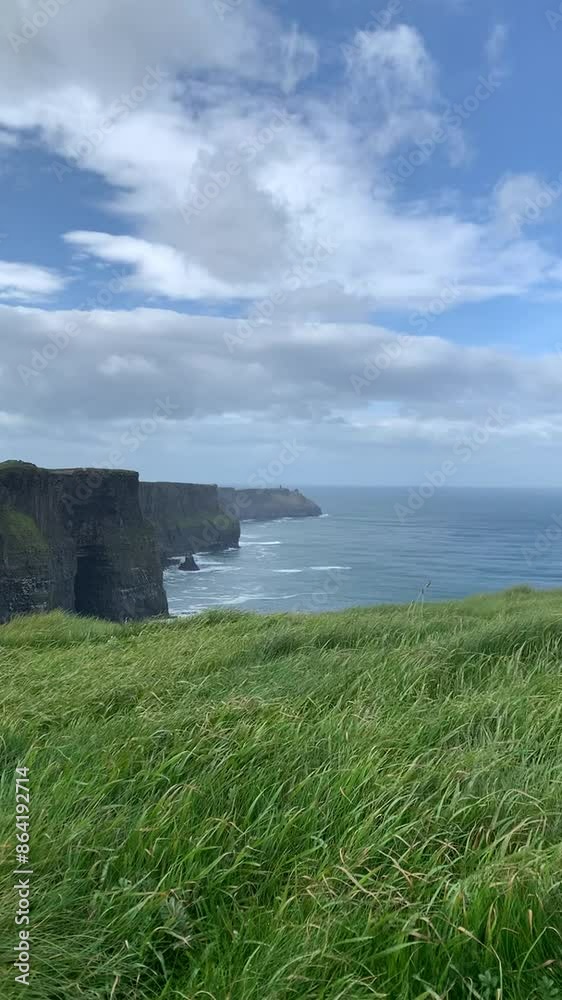 A breathtaking video of the Cliffs of Moher in Ireland, showcasing the dramatic, towering sea cliffs against a dynamic sky. A breathtaking video of the Cliffs of Moher in Ireland, showcasing the dramatic, towering sea cliffs against a dynamic sky.