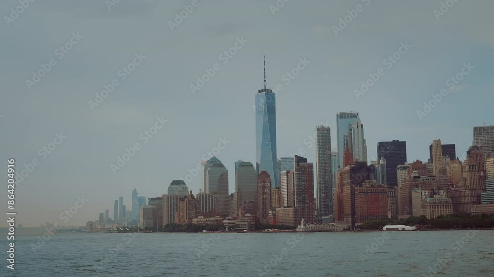 The view of the Downtown Manhattan skyline from the boat on the Hudson river on a cloudless day. NYC skyscrapers and World Trade Center shot from the boat. The view of the Downtown Manhattan skyline from the boat on the Hudson river on a cloudless day. NYC skyscrapers and World Trade Center shot from the boat.