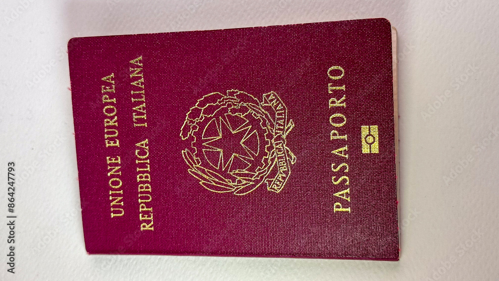 Italian passport European Union visa travel with red cover before plain white background on the back Italian passport European Union visa travel with red cover before plain white background on the back