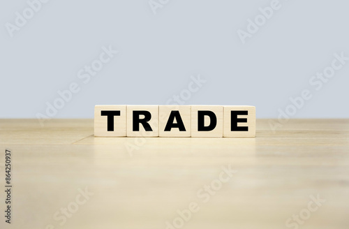 Trade word written on wooden blocks. Trade text for your desing, concept.