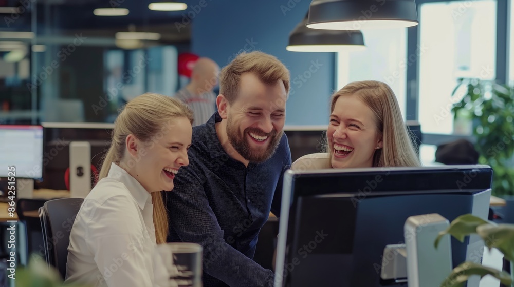 Happy colleagues in the office discussing the work process looking at the monitor and smiling. Business goals and team building concept. Concept of team office work Happy colleagues in the office discussing the work process looking at the monitor and smiling. Business goals and team building concept. Concept of team office work