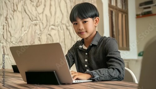 A boy with his laptop photo