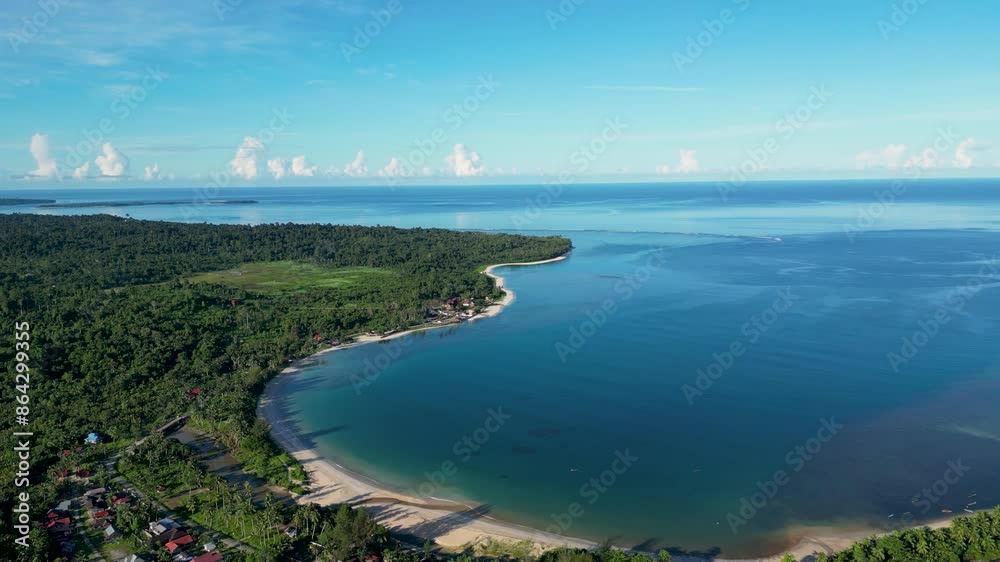 Drone shot of the coast of Sipora Island. Sunny morning, holiday destination, palm trees, beach, ocean, single buildings. Mentawai Islands, Indonesia, Sumatra, Asia, 4K. Drone shot of the coast of Sipora Island. Sunny morning, holiday destination, palm trees, beach, ocean, single buildings. Mentawai Islands, Indonesia, Sumatra, Asia, 4K.