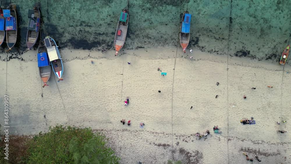 Longtail Boats moored at tropical island beach. Nice aerial view flight drone Longtail Boats moored at tropical island beach. Nice aerial view flight drone