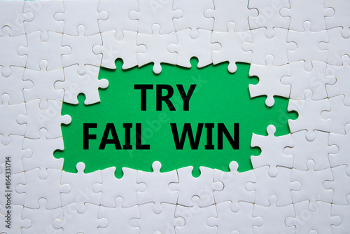 Try Fail Win symbol. Concept words Try Fail Win on white puzzle. Beautiful green background. Business and Try Fail Win concept. Copy space.