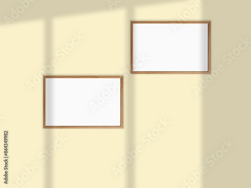 Mockup withl picture frames side by side on a wall, close up, bright