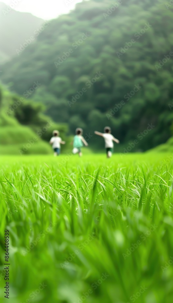 Children running joyfully in a lush, green field with a scenic mountain background. Perfect image capturing youthful exuberance and natural beauty. Children running joyfully in a lush, green field with a scenic mountain background. Perfect image capturing youthful exuberance and natural beauty.