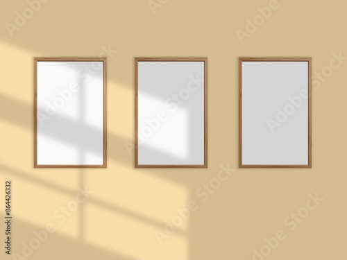 Vertical picture frames mockup with wal, Sunlight.