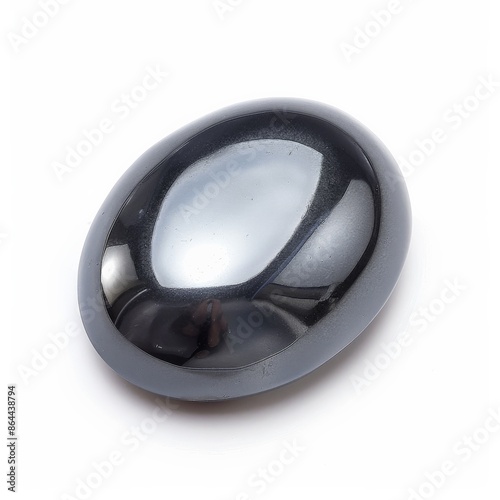 A close-up shot of a smooth, polished hematite gemstone on a white background