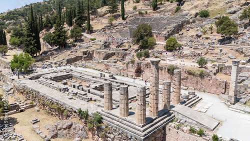 Aerial bird's eye view photo taken by drone of archaeological site of ancient Delphi, site of temple of Apollo and the Oracle, Voiotia, Greece photo