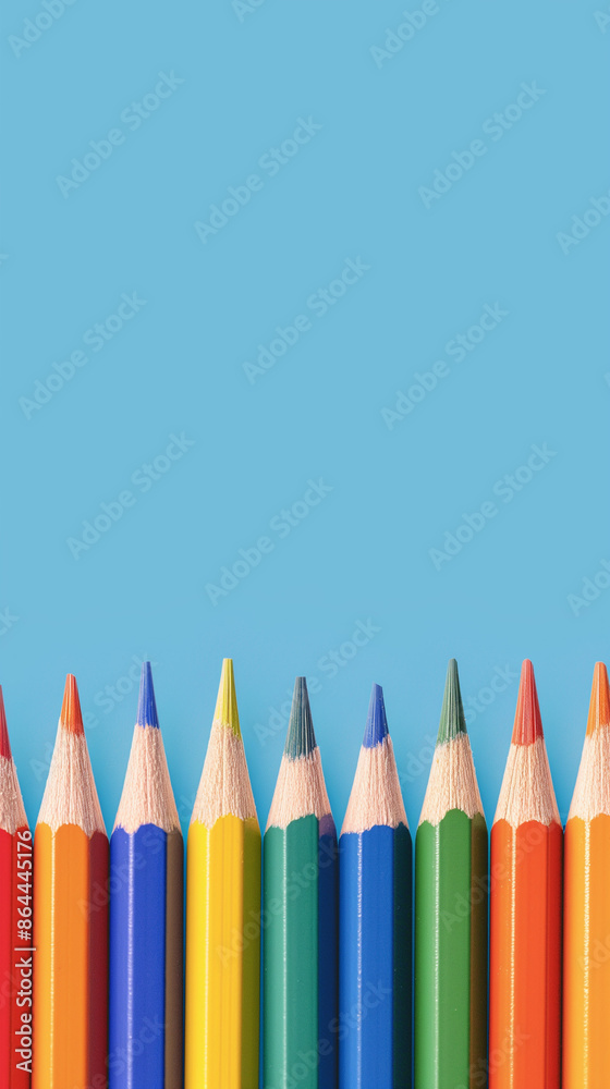 Row of multi-colored pencils on a pink, blue, red and yellow backgrounds Row of multi-colored pencils on a pink, blue, red and yellow backgrounds
