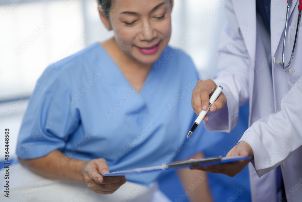 Doctor explaining medical results to a patient in a hospital setting, highlighting a compassionate healthcare interaction, blue scrubs. Doctor explaining medical results to a patient in a hospital setting, highlighting a compassionate healthcare interaction, blue scrubs.