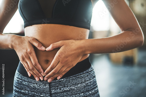Canvas Print Health, digestion and hands on stomach for woman in gym, nutrition and gut support detox