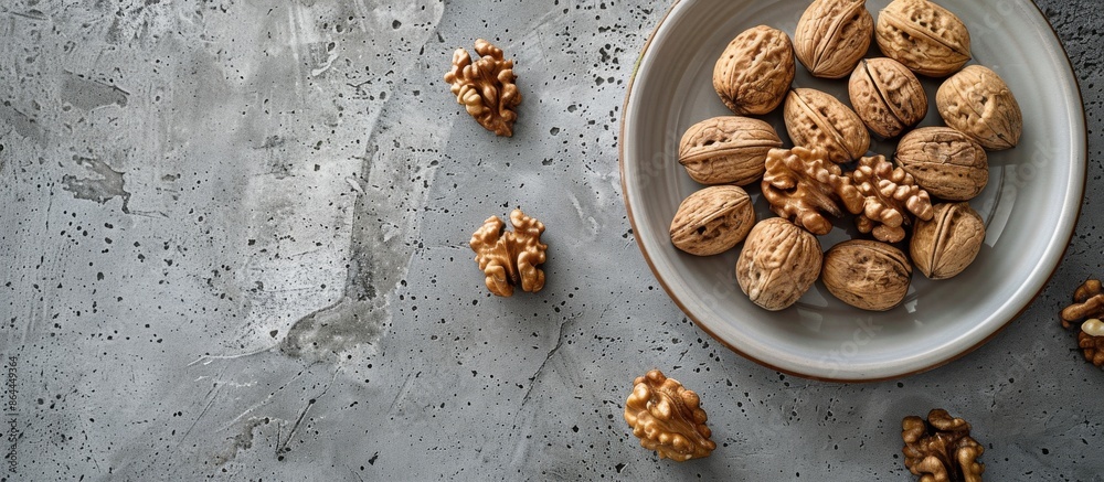 Fresh Walnuts on a Plate and Grey Concrete Surface