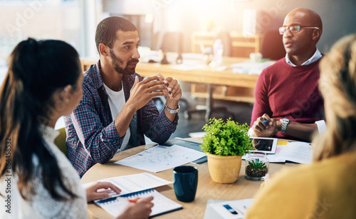 Man, business meeting and startup with documents in office with discussion, planning and teamwork. Group, paperwork and diversity with conversation, problem solving and solution at creative agency
