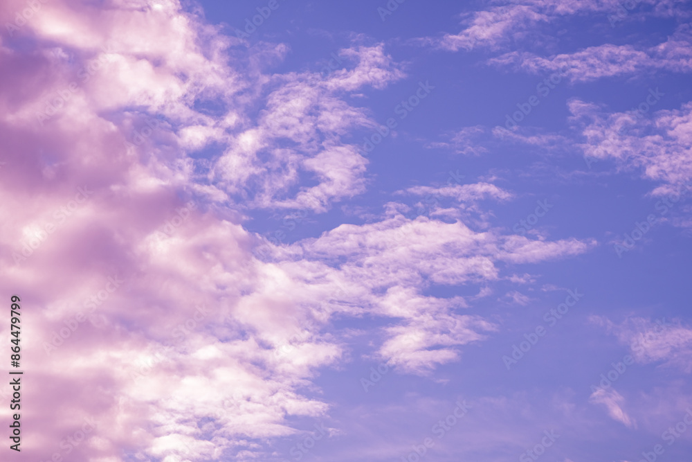 Beautiful fabulous pink cumulus clouds in the blue sky at sunset. natural background Beautiful fabulous pink cumulus clouds in the blue sky at sunset. natural background
