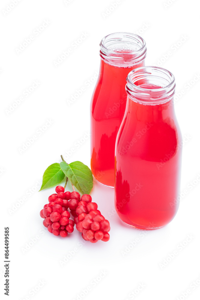 Schisandra berry juice in glass bottles isolated on white Schisandra berry juice in glass bottles isolated on white