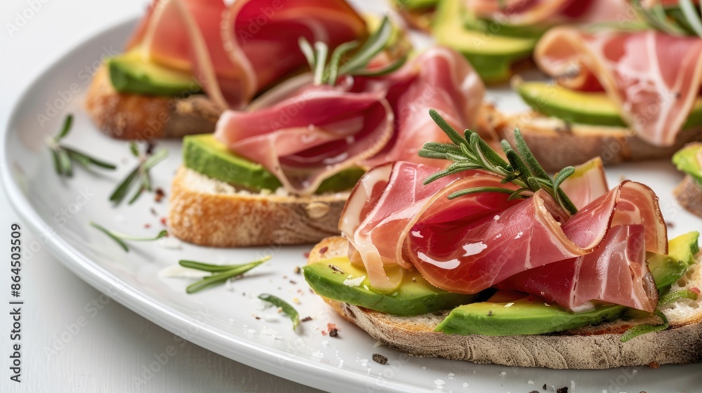 Turkey ham bruschetta on avocado slices on clean white background for elegant presentation Turkey ham bruschetta on avocado slices on clean white background for elegant presentation