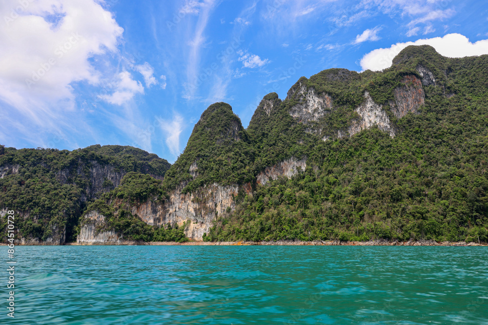 View to the rock islands on Cheo Lan lake at Surat Thani province of Thailand. Picturesque landscape of national Khao Sok park View to the rock islands on Cheo Lan lake at Surat Thani province of Thailand. Picturesque landscape of national Khao Sok park