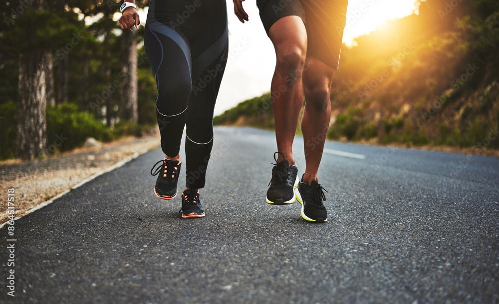 Sports, legs and people running on road for outdoor race or marathon training in mountain. Fitness, friends and body of athletes with cardio workout for endurance exercise in street for practice. Sports, legs and people running on road for outdoor race or marathon training in mountain. Fitness, friends and body of athletes with cardio workout for endurance exercise in street for practice.
