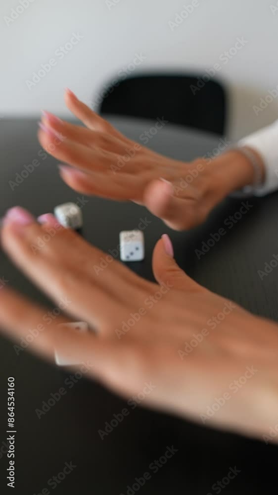 A detailed photograph capturing hands rolling dice in the midst of a gaming session A detailed photograph capturing hands rolling dice in the midst of a gaming session