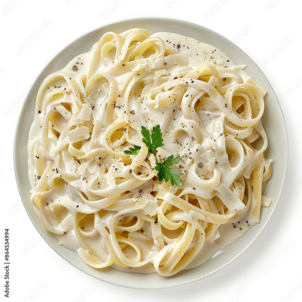 A plate of pasta with creamy alfredo sauce and parmesan, isolated on white background A plate of pasta with creamy alfredo sauce and parmesan, isolated on white background