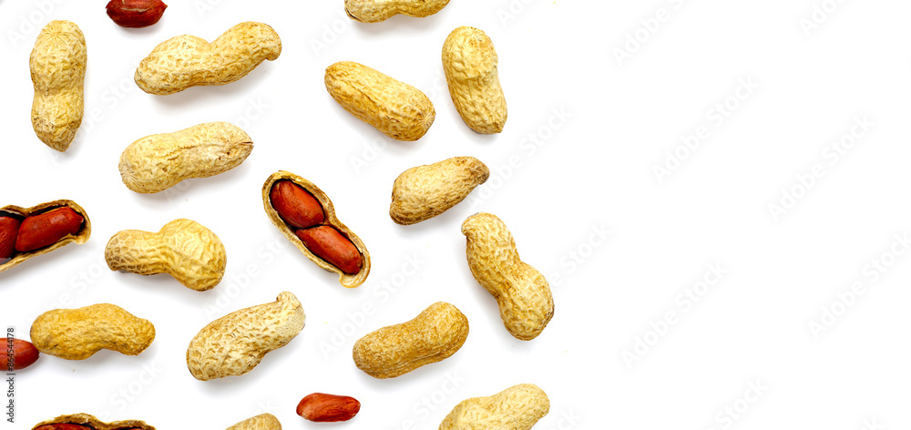 Roasted peanuts in shell on white background. Roasted peanuts in shell on white background.
