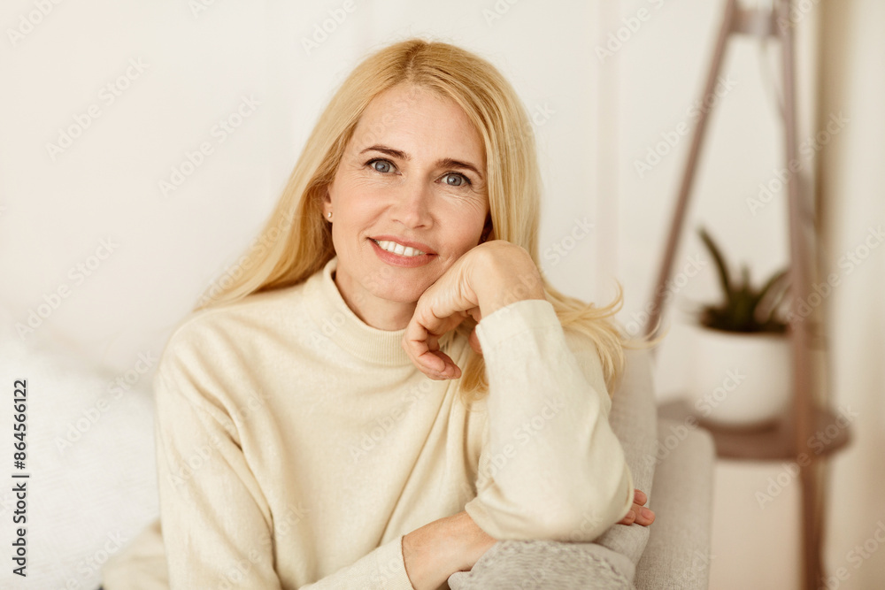 Portrait Of Mature Woman Smiling At Camera, Resting At Home Portrait Of Mature Woman Smiling At Camera, Resting At Home