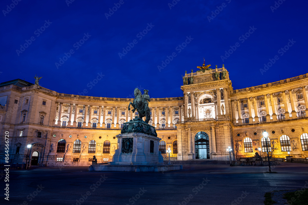 Vienna, Austria, August 18, 2022. The Hofburg Imperial Palace at blue hour. The illumination enhances the impressive facade. Vienna, Austria, August 18, 2022. The Hofburg Imperial Palace at blue hour. The illumination enhances the impressive facade.