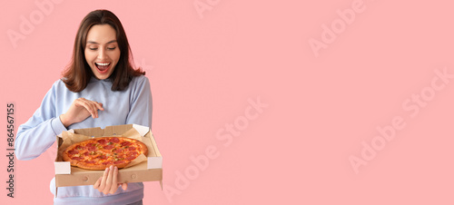 Happy young woman holding c...