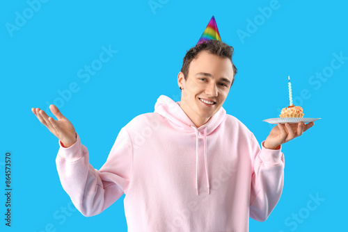 Young man with birthday cak...