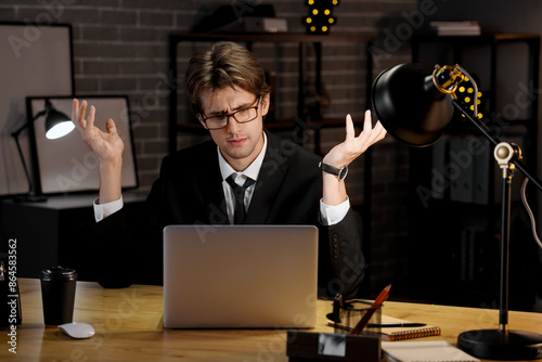 Displeased young businessma...