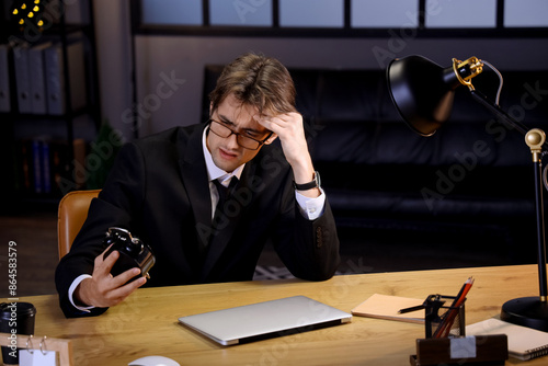 Young businessman with alar...