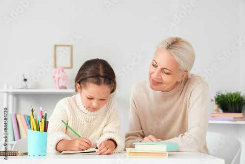 Little girl with her grandm...