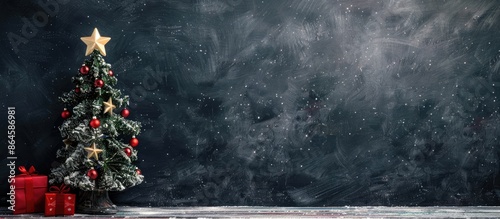 Santa Claus figurine with Christmas tree and stars displayed in front of a blackboard with empty space for text or graphics, known as a copy space image. photo