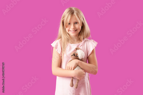Cute little girl with plush...