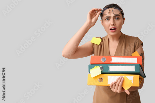 Shocked young businesswoman...