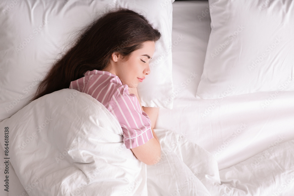 Pretty young woman sleeping in cozy bed Pretty young woman sleeping in cozy bed