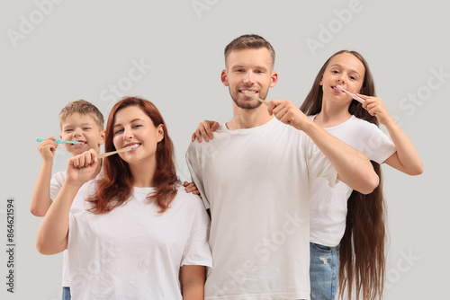 Happy family brushing teeth...