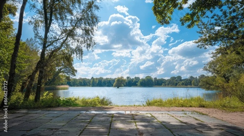 Blue sky and a vacant square ground overlooking a lake in nature