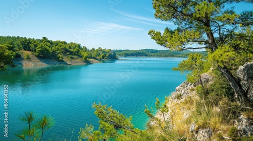 Scenic views on a bright summer day overlooking a lake with turquoise water