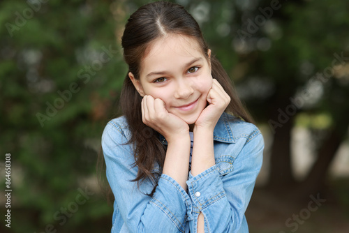 Portrait of beautiful little girl outdoors. Cute child