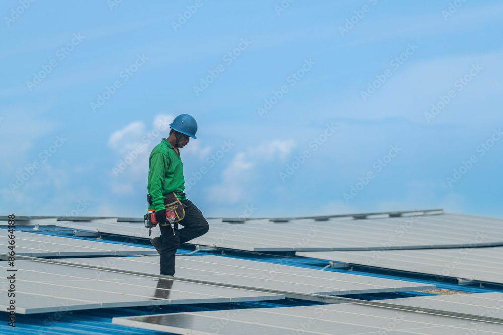 Worker Technicians are working to construct solar panels system on roof. Installing solar photovoltaic panel system. Men technicians walking on roof structure to check photovoltaic solar modules. Worker Technicians are working to construct solar panels system on roof. Installing solar photovoltaic panel system. Men technicians walking on roof structure to check photovoltaic solar modules.