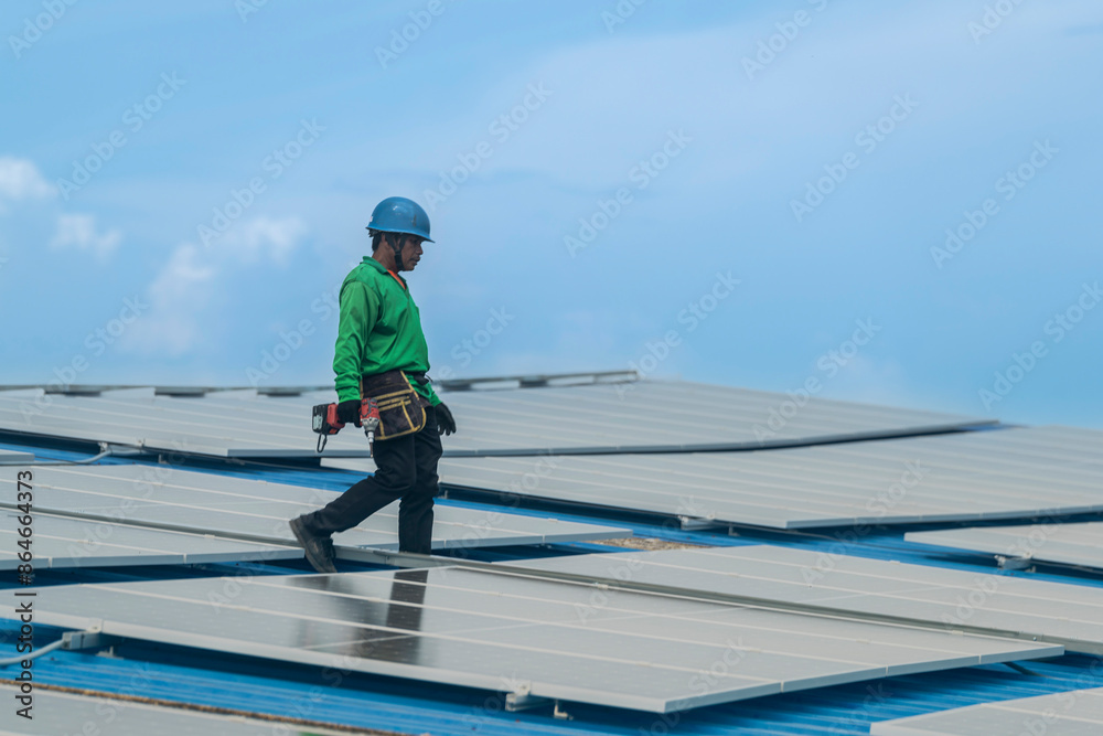 Worker Technicians are working to construct solar panels system on roof. Installing solar photovoltaic panel system. Men technicians walking on roof structure to check photovoltaic solar modules. Worker Technicians are working to construct solar panels system on roof. Installing solar photovoltaic panel system. Men technicians walking on roof structure to check photovoltaic solar modules.
