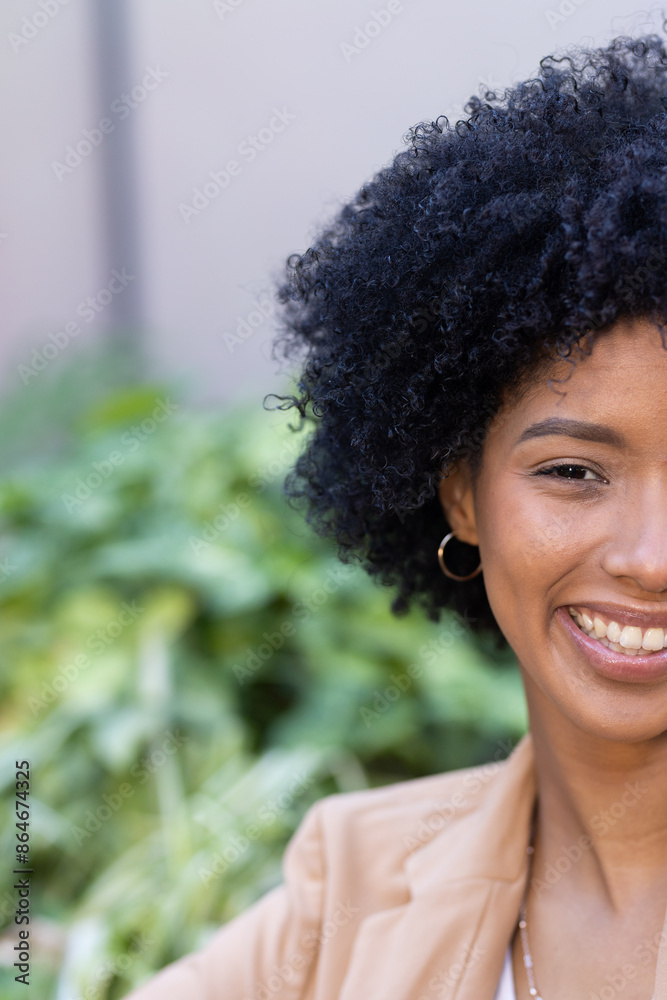 Enjoying break outdoors, smiling woman in casual business attire Enjoying break outdoors, smiling woman in casual business attire