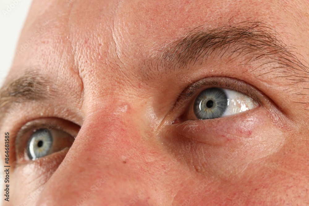 Fototapeta premium Man with beautiful blue eyes, closeup view